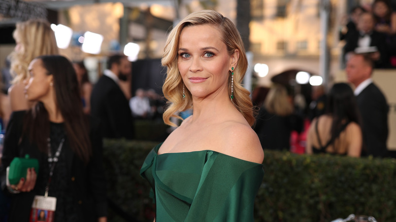 Reese Witherspoon in an off-the-shoulder green dress