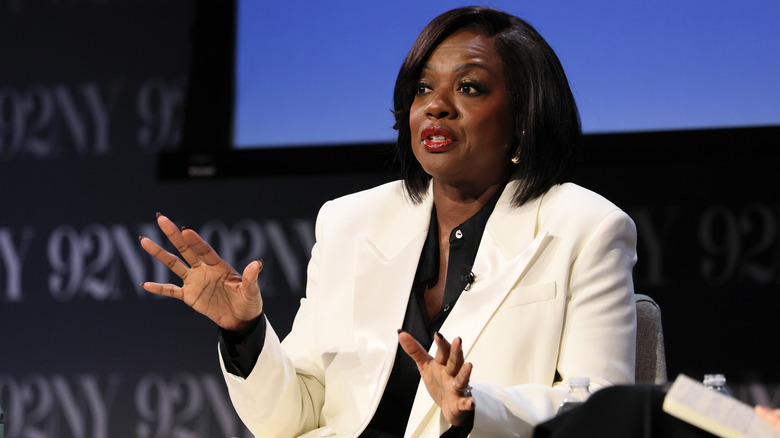 Viola Davis gesturing with her hands during an onstage talk at 92NY