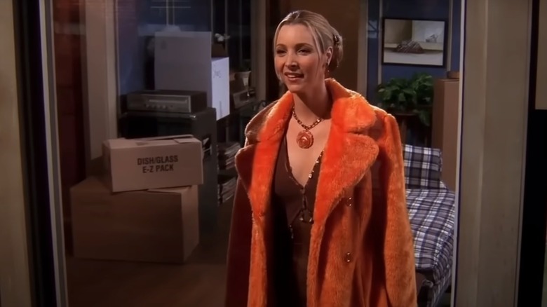 Phoebe Buffay in a fluffy, orange coat