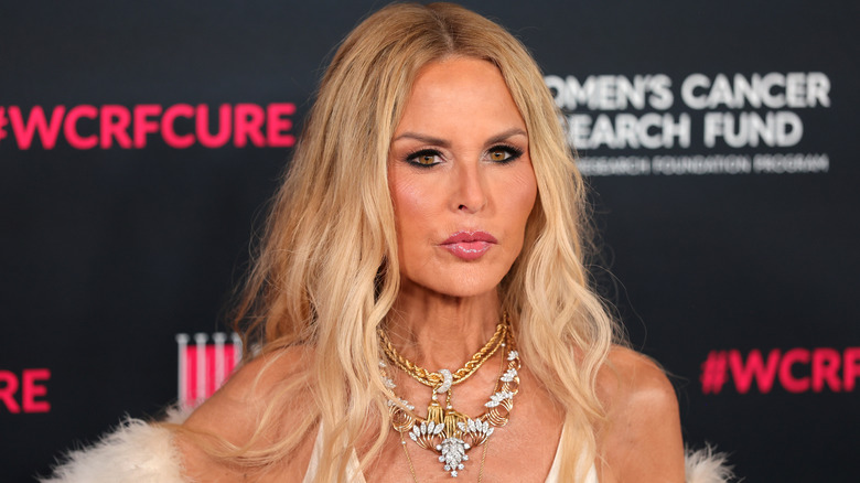 Rachel Zoe wearing a large jewelled necklace and black smoky eye