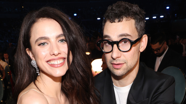 Margaret Qualley in a sleeveless dress and Jack Antonoff at an event