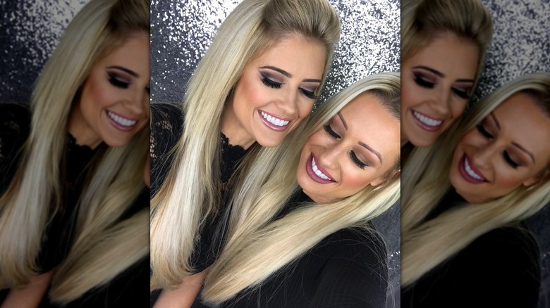 Christina Haack posing with a friend with long, straight hair