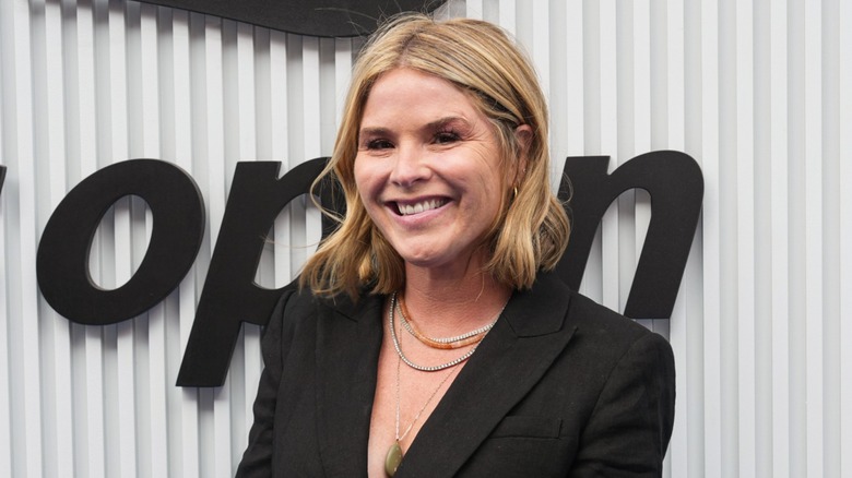 Jenna Bush Hager smiling in front of a neutral background