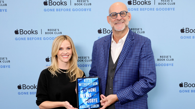 Reese Witherspoon and best-selling author Harlan Coben at the Gone Before Goodbye book launch at Apple SoHo on October 14, 2025