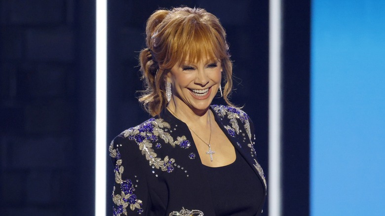 Reba McEntire smiling on stage