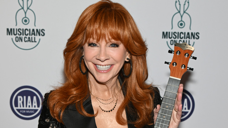 Reba McEntire smiles on the red carpet in 2026