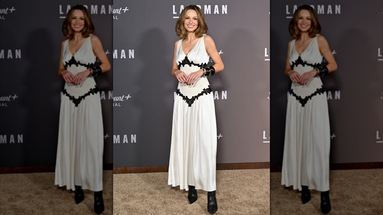 Kayla Wallace wearing a silk, white-and-black dress at the Season 1 premiere of "Landman"