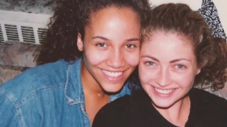 Young Rebecca Gayheart smiling while posing with her New York roommate in the '90s
