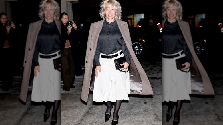Pamela Anderson wearing black shirt on white skirt