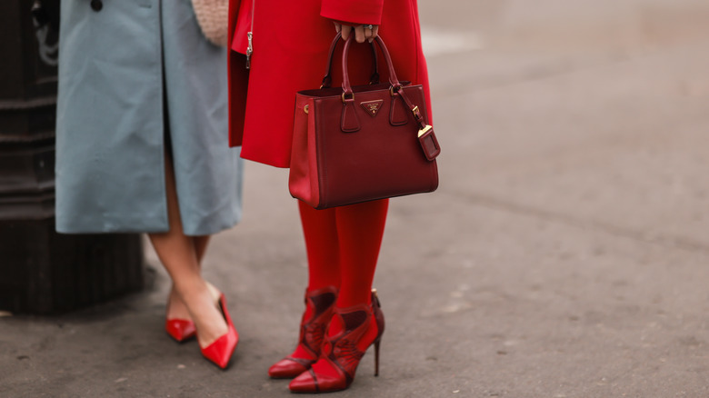 Women wearing red accessories 