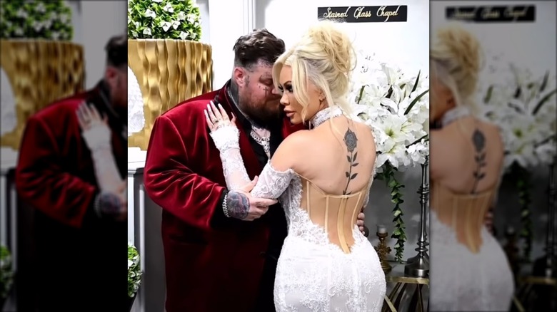 Jelly Roll and Bunnie Xo embracing one another in a wedding chapel