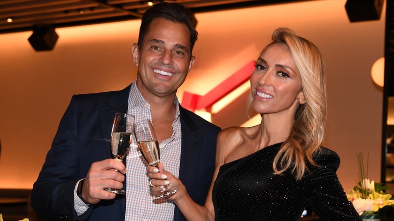 Bill Rancic and Giuliana Rancic toasting