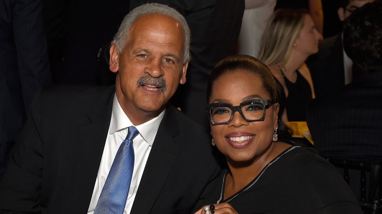 Stedman Graham posing with Oprah Winfrey