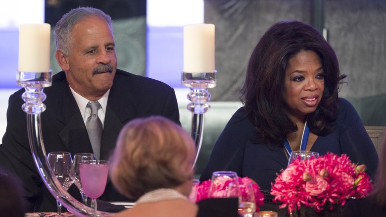 Stedman Graham sitting next to Oprah Winfrey