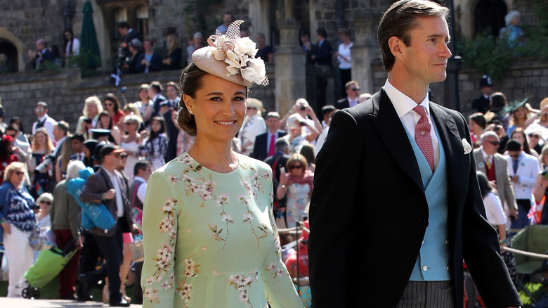Pippa Middleton walking with her husband at an event