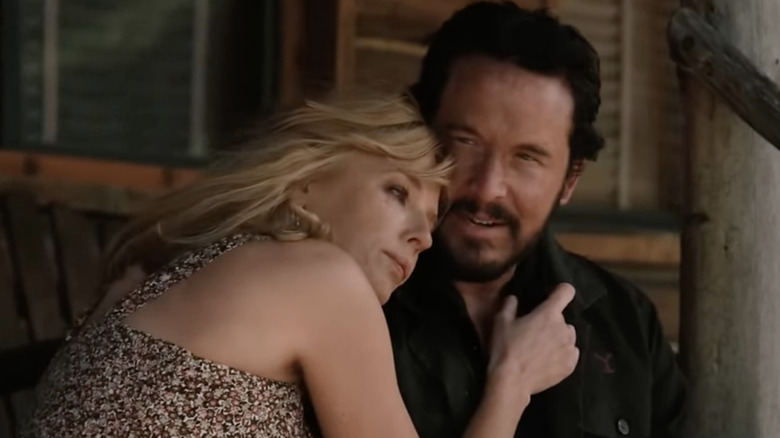 Beth Dutton sits next to Rip Wheeler cuddling in an episode of Yellowstone