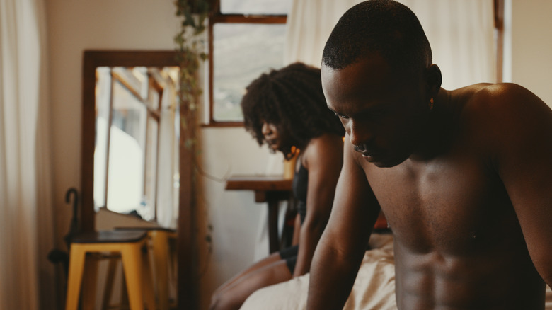 couple arguing in bed