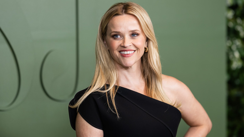 Reese Witherspoon posing and smiling at a WSJ event