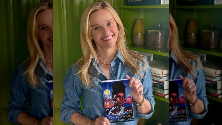 Reese Witherspoon holding Once Upon a Time in Dollywood by Ashley Jordan