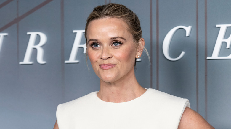 Reese Witherspoon on the red carpet in a white dress