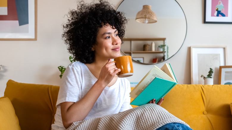 Woman reading a book and smiling