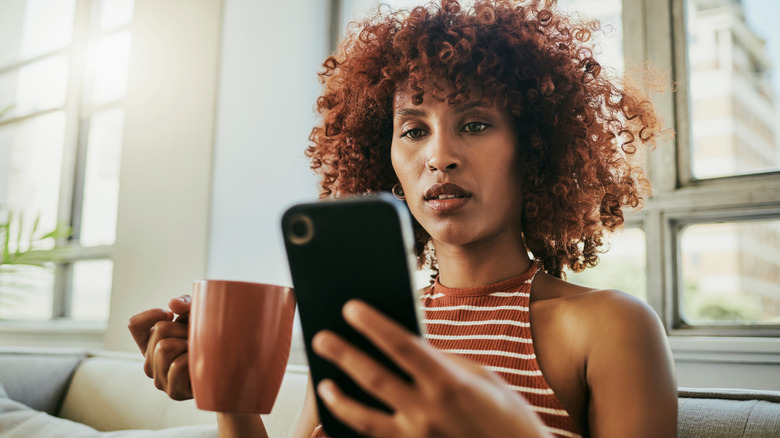 Woman reading her phone