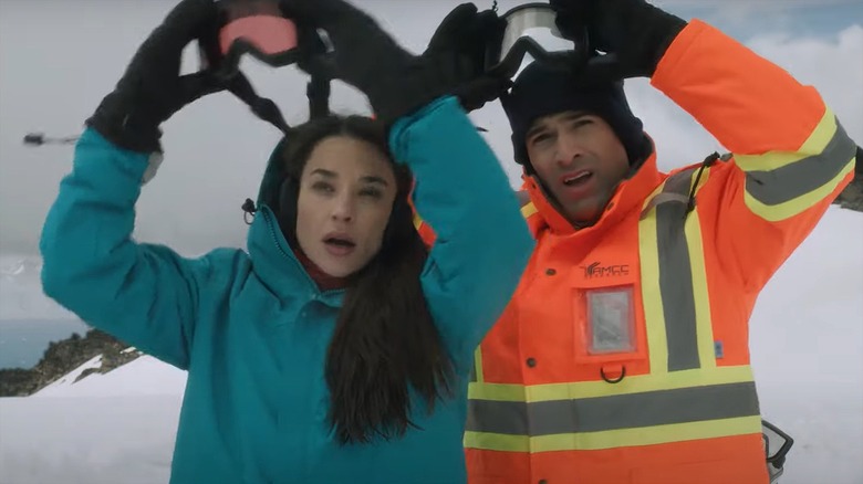 The couple in "Polar Opposites" in the snow