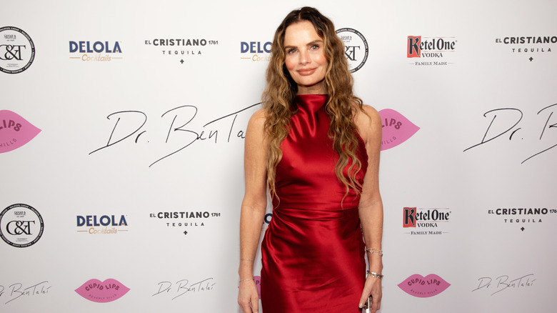 Gabrielle Anwar smiles on the red carpet in 2024