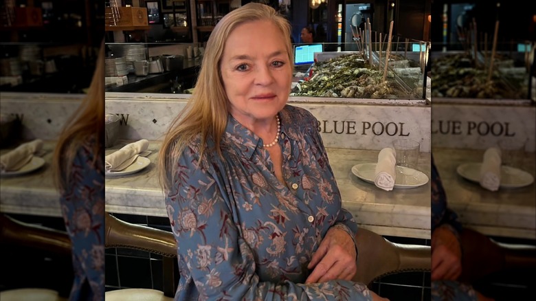Robin Mattson posing at a restaurant in 2025