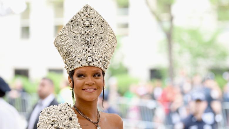 Rihanna at the 2018 met gala in head piece