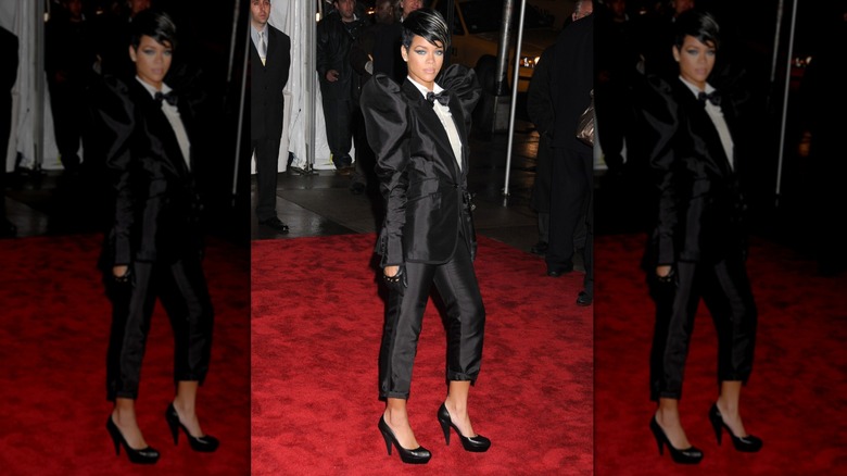Rihanna at 2009 Met Gala in a tuxedo suit with puffy shoulders