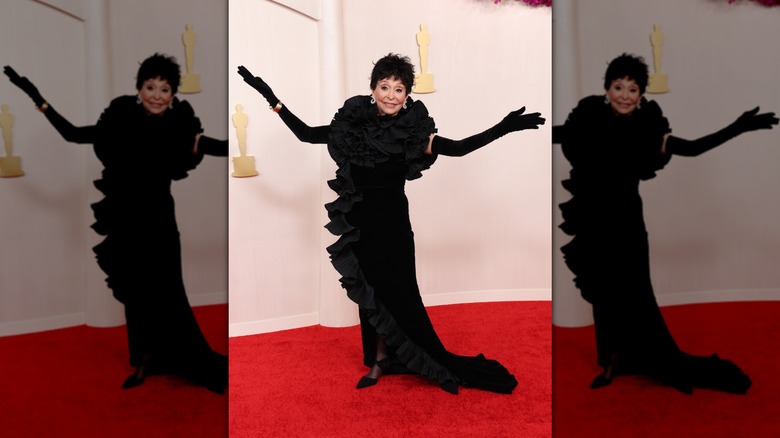 Rita Moreno on the red carpet in a black dress