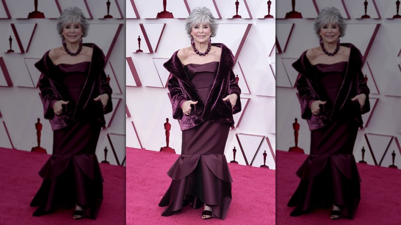 Rita Moreno with silver hair in a monochrome outfit