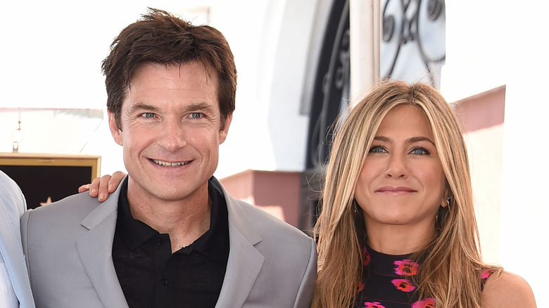 Jennifer Aniston standing next to Jason Bateman