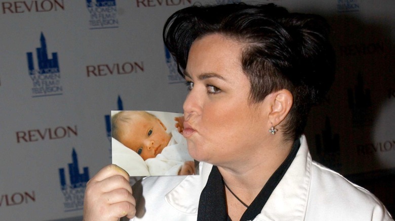 Rosie O'Donnell kissing a photo of Vivienne O'Donnell on the red carpet at the 2002 Muse Awards Luncheon
