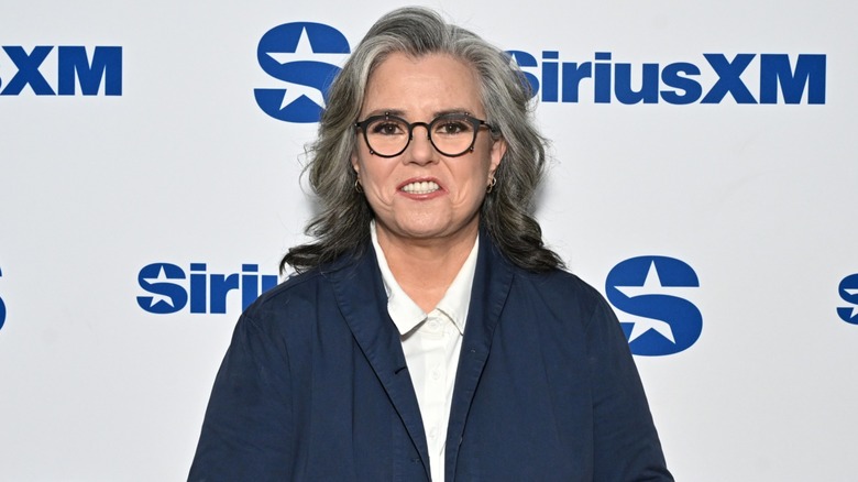 Rosie O'Donnell smiling in front of a blue and white SiriusXM background in 2026
