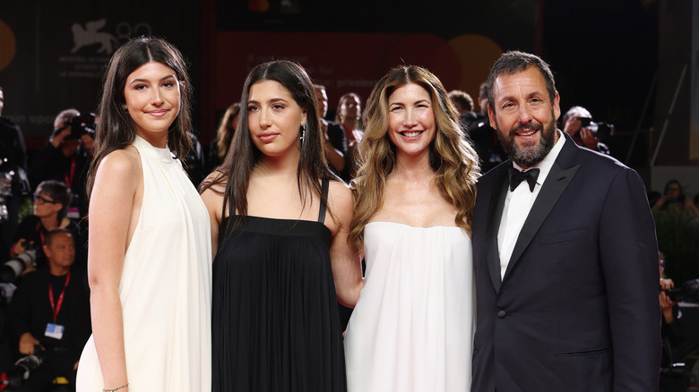 Sunny Sandler, Sadie Sandler, Jackie Sandler, and Adam Sandler pose on the red carpet