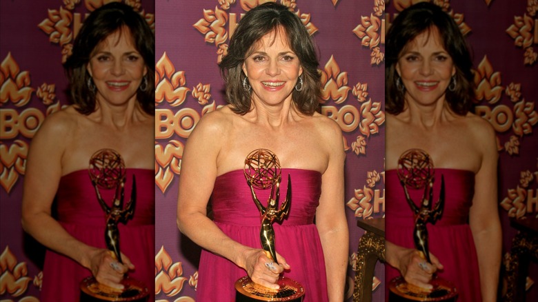 Sally Field smiling while holding an Emmy