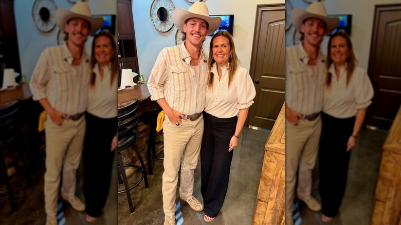 Sarah Huckabee Sanders standing next to a man in a cowboy hat