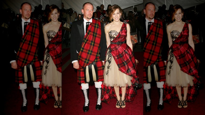 Sarah Jessica Parker smiles next to Alexander McQueen wearing a tartan sash