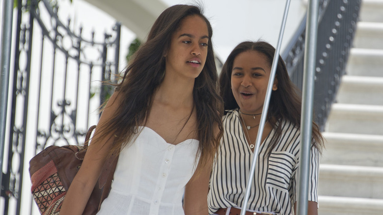 Malia and Sasha Obama depart ahead of their parents United States President Barack Obama and first lady Michelle Obama depart the White House August 6, 2016