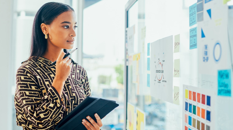 Woman studying business strategy details