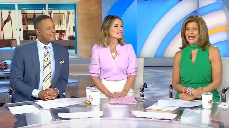 Craig Melvin, Savannah Guthrie, and Hoda Kotb sitting at a desk on Today