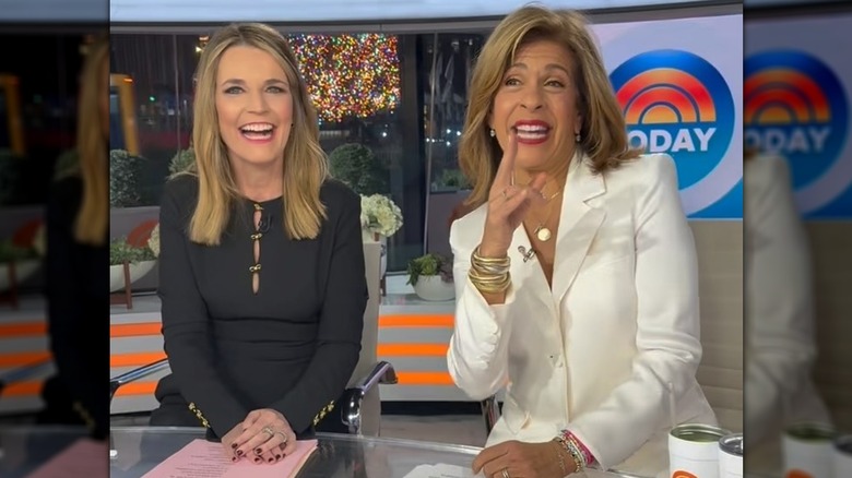 Savannah Guthrie sitting alongside Hoda Kotb on Today in a black outfit