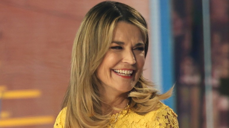 Savannah Guthrie smiling in a yellow dress