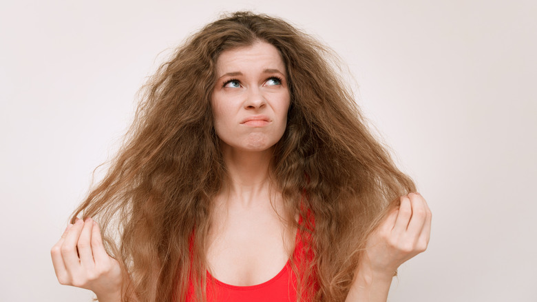 Woman with frizzy unmanageable hair