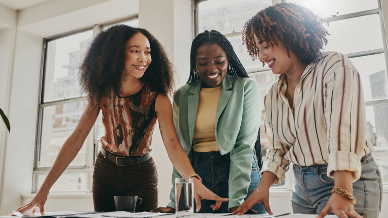 Women working together and smiling