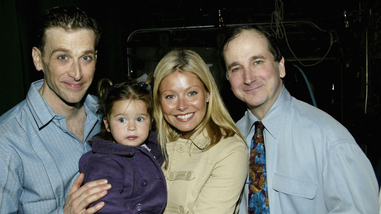 Jay Goede, Lola Consuelos and mother Kelly Ripa with Mark Linn-Baker smiling