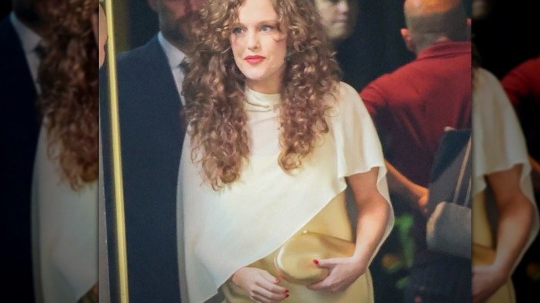 Abigail Anderson and Taylor Swift posing and smiling at an event.