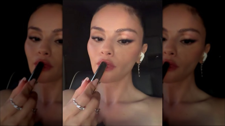 Selena Gomez applying lipstick in the car in an Instagram Story on July 2, 2026